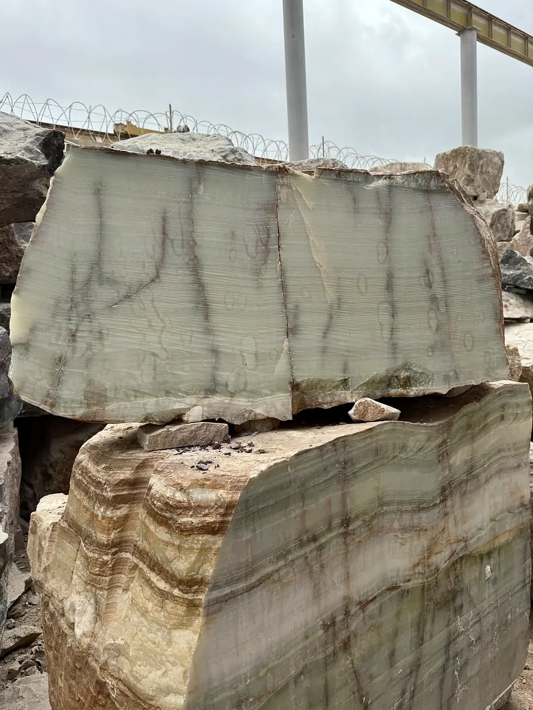 Natural onyx block cut to reveal its authentic cream and green veining